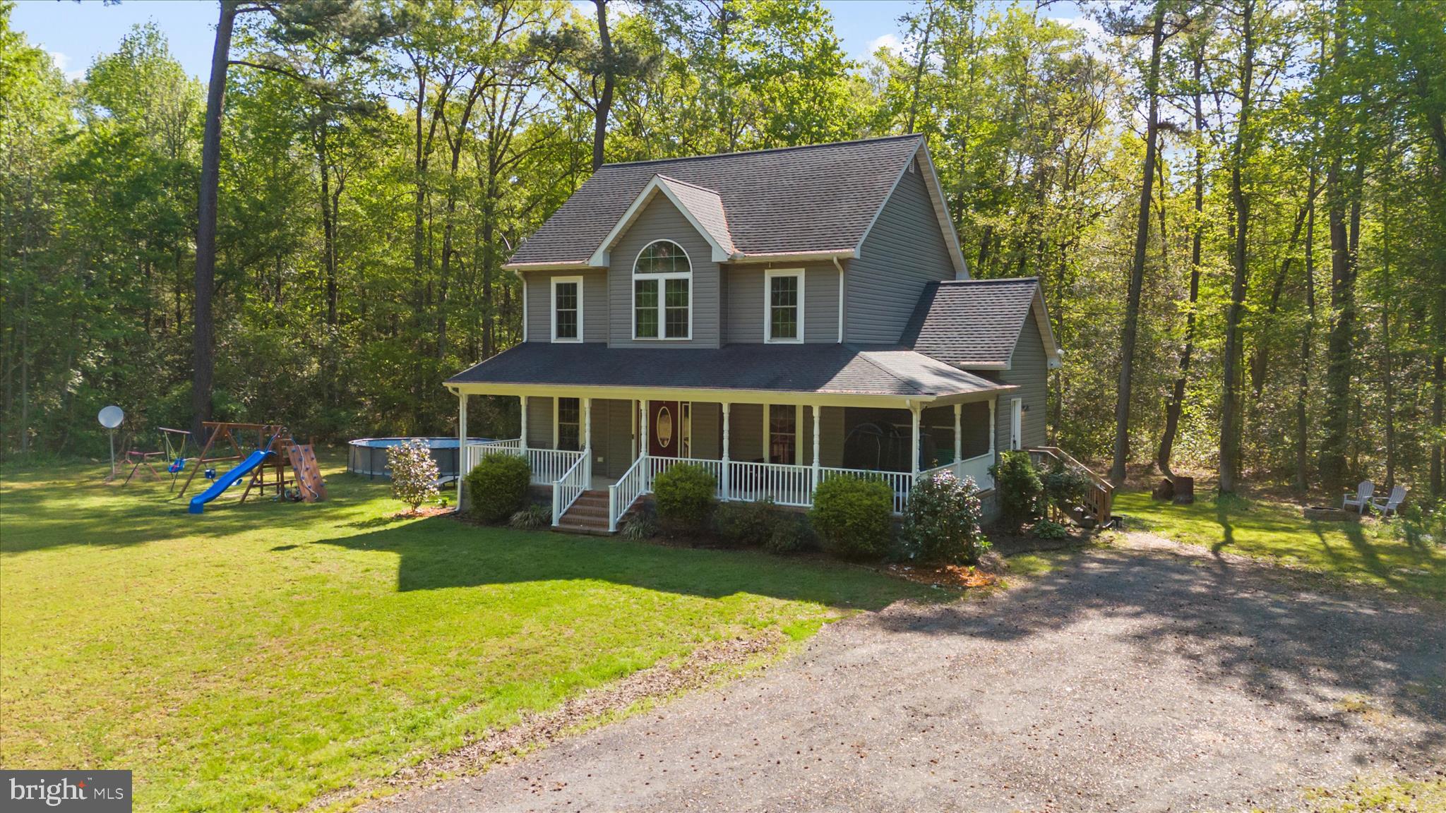 6941 Hubbard Road Hurlock, MD 21643 - Photo 2 of 71 a front view of a house with garden