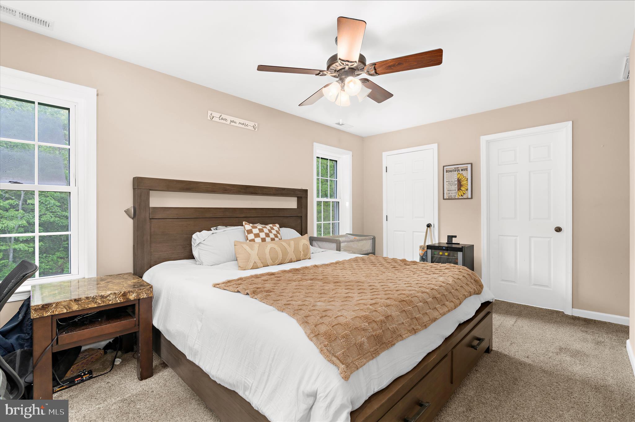 6941 Hubbard Road Hurlock, MD 21643 - Photo 28 of 71 a bedroom with a bed and a chandelier