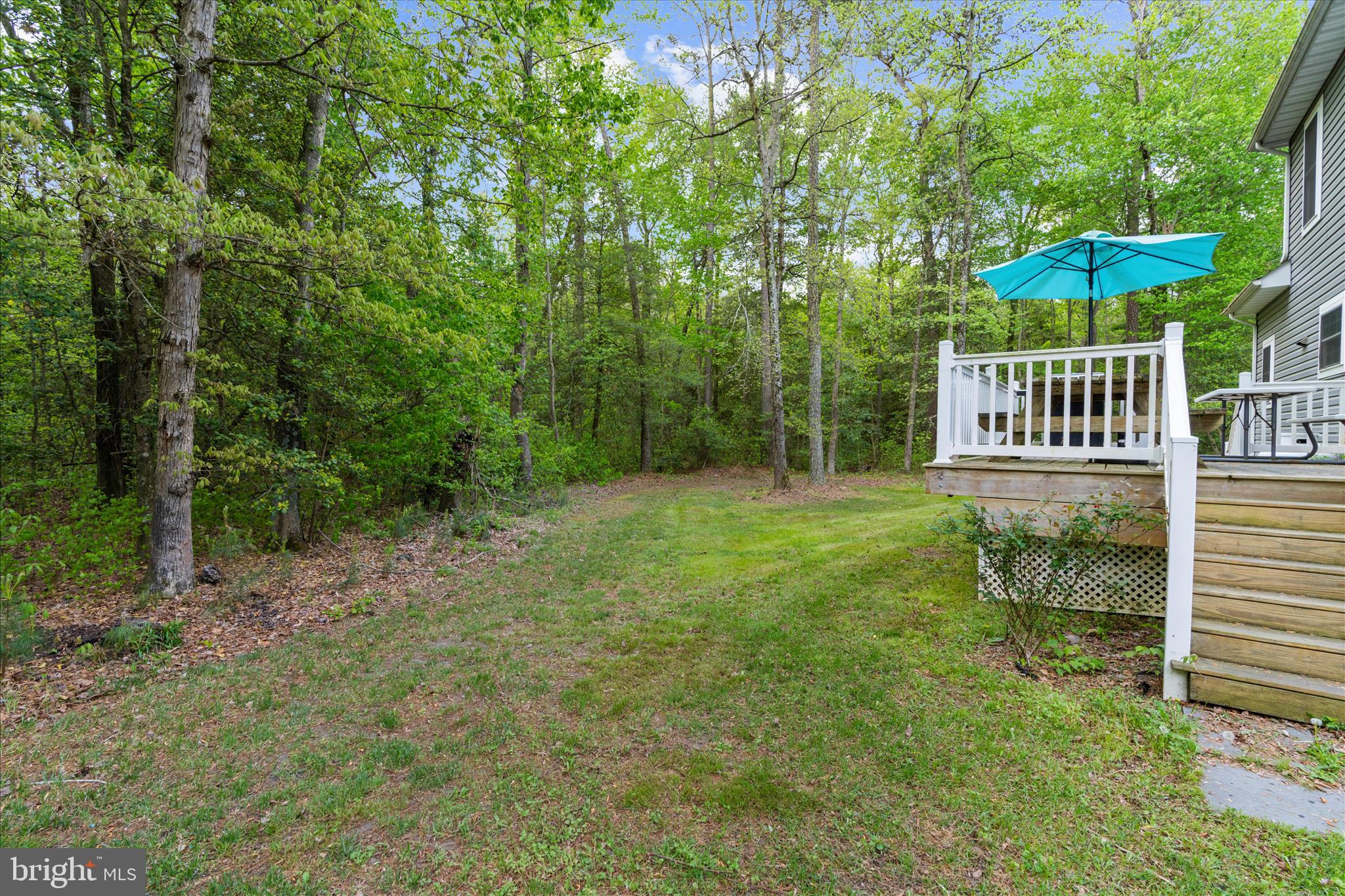 6941 Hubbard Road Hurlock, MD 21643 - Photo 35 of 71 a view of a chair and table in the backyard
