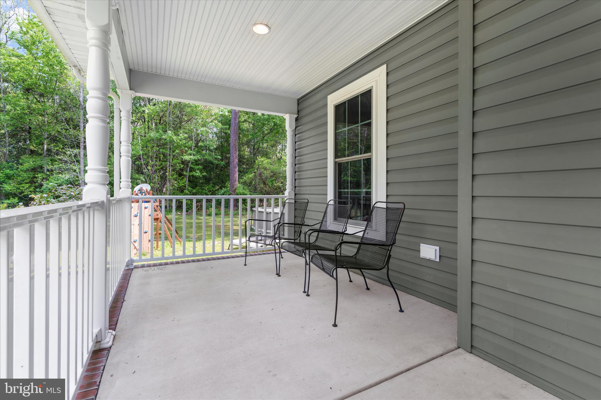 6941 Hubbard Road Hurlock, MD 21643 - Photo 39 of 71 a view of a chairs and table in the balcony