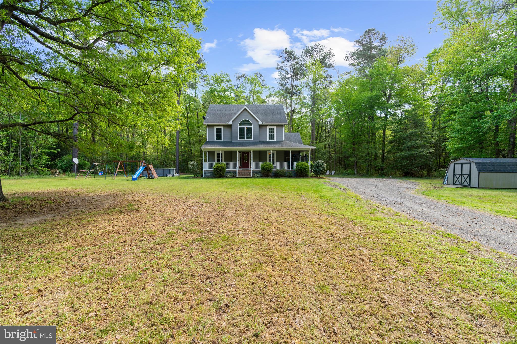 6941 Hubbard Road Hurlock, MD 21643 - Photo 41 of 71 a front view of a house with a yard