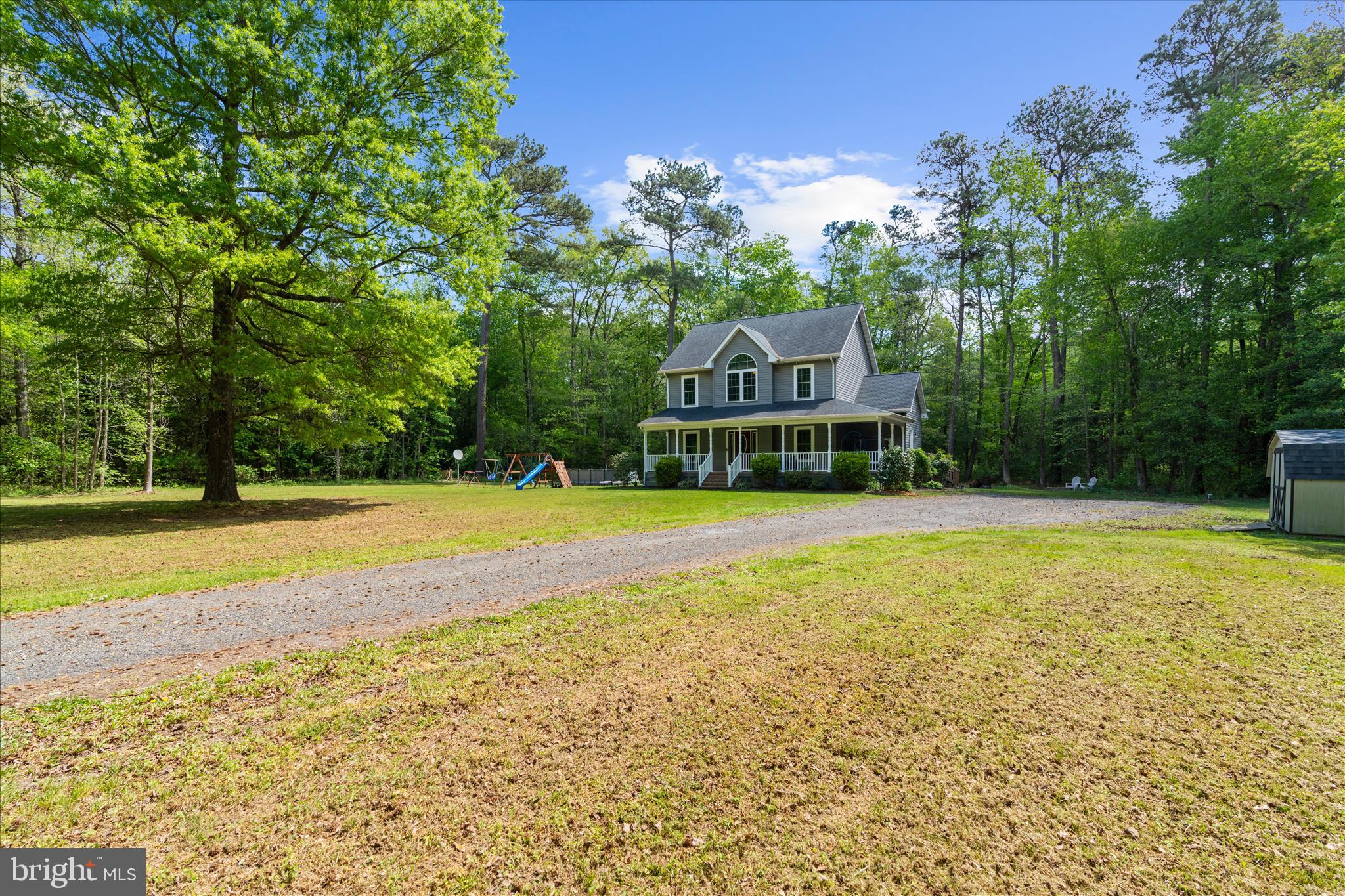 6941 Hubbard Road Hurlock, MD 21643 - Photo 42 of 71 a view of a house with a yard