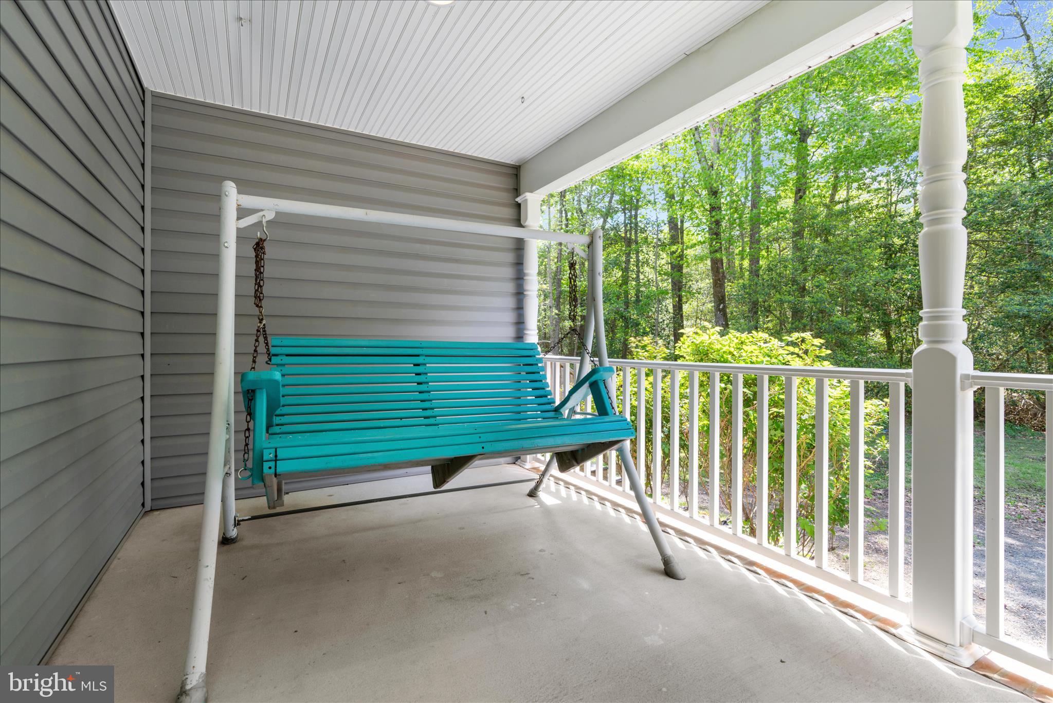 6941 Hubbard Road Hurlock, MD 21643 - Photo 45 of 71 a view of a deck with a yard and floor to ceiling window