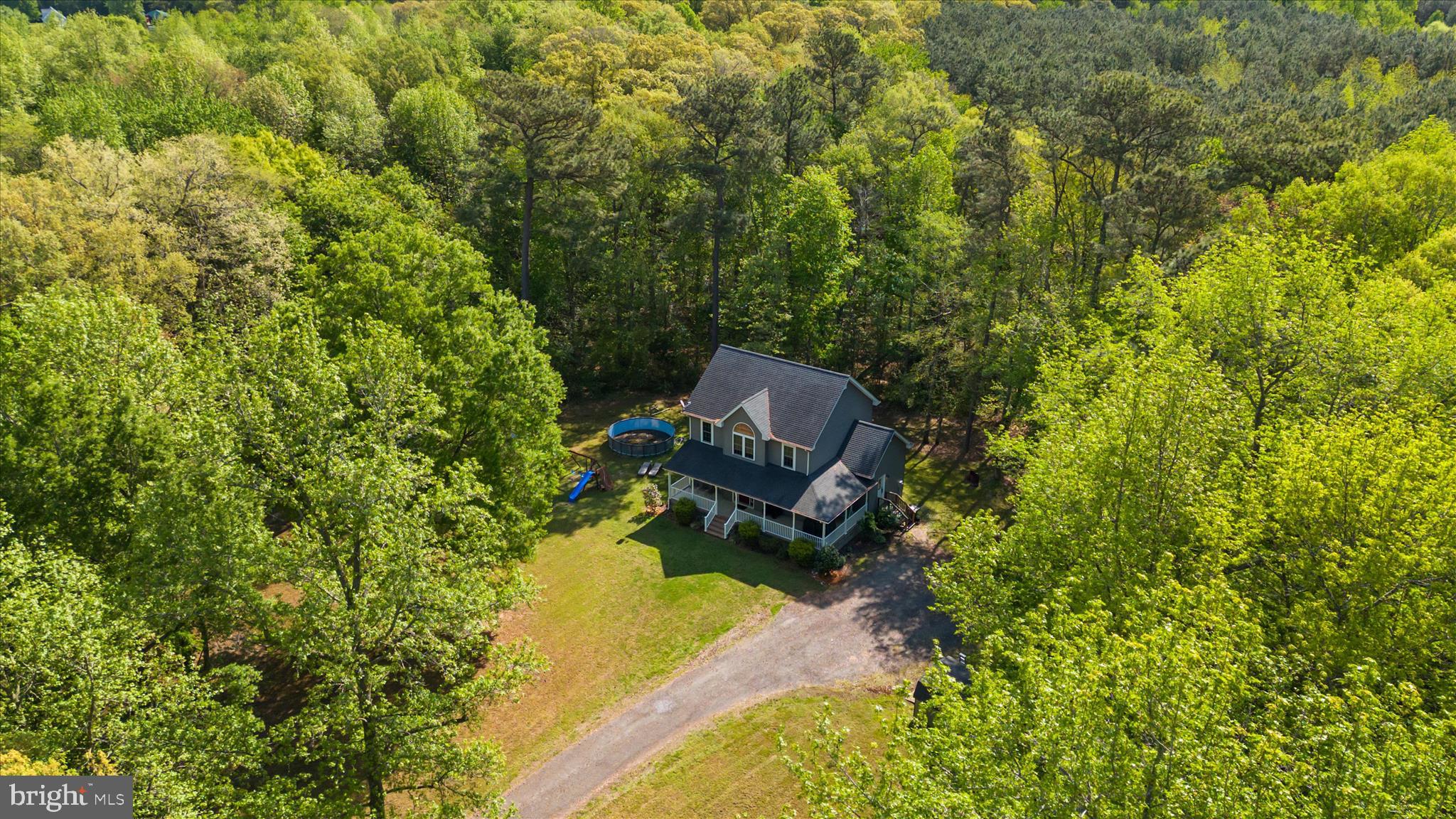 6941 Hubbard Road Hurlock, MD 21643 - Photo 56 of 71 a view of a house with a yard and sitting area