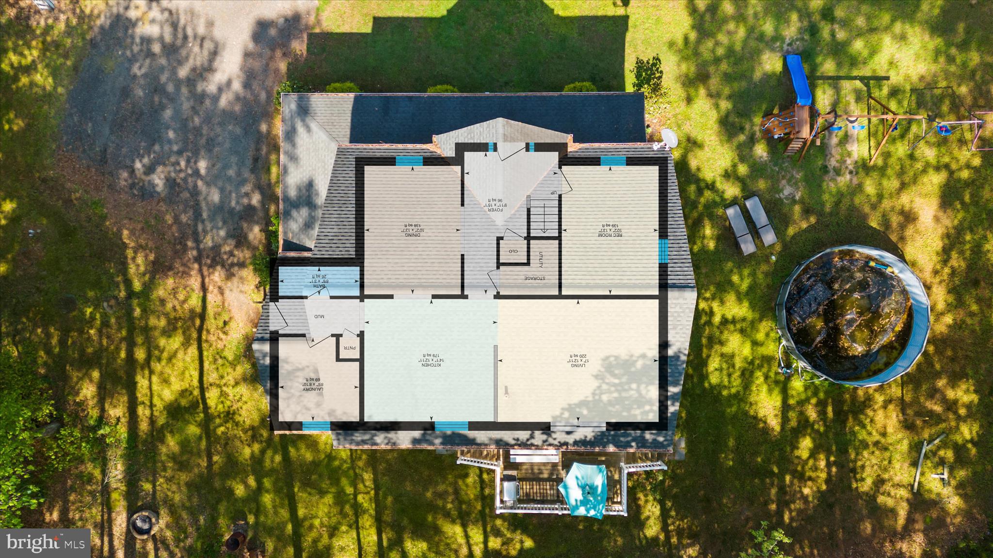 6941 Hubbard Road Hurlock, MD 21643 - Photo 63 of 71 aerial view of a house with swimming pool and lawn chairs under an umbrella