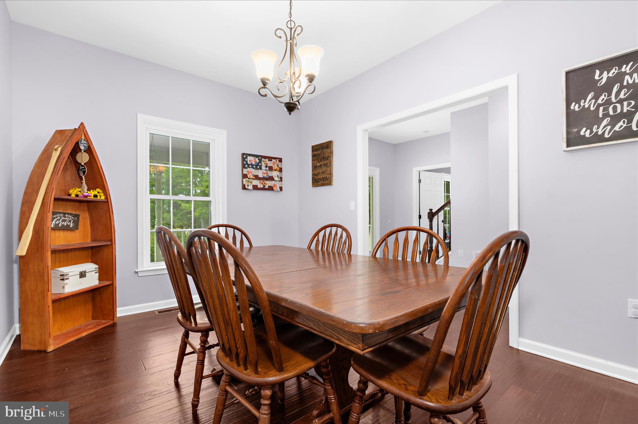 6941 Hubbard Road Hurlock, MD 21643 - Photo 7 of 71 a view of a dining room with furniture wooden floor and chandelier