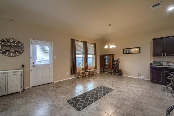 a view of a livingroom with furniture and an empty room