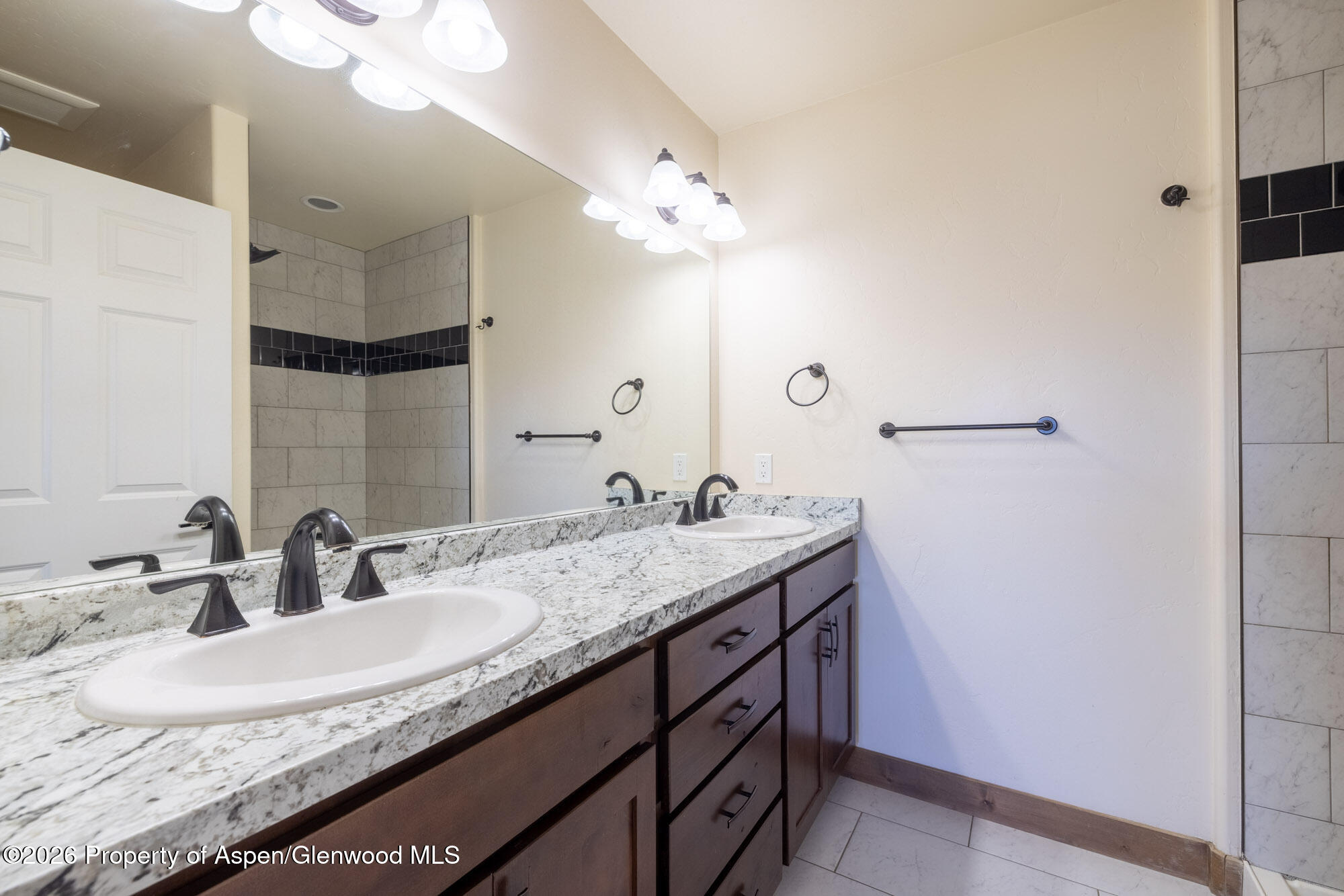 2016 Ballard Avenue Silt, CO 81652 - Photo 11 of 23 a bathroom with a granite countertop sink and a mirror