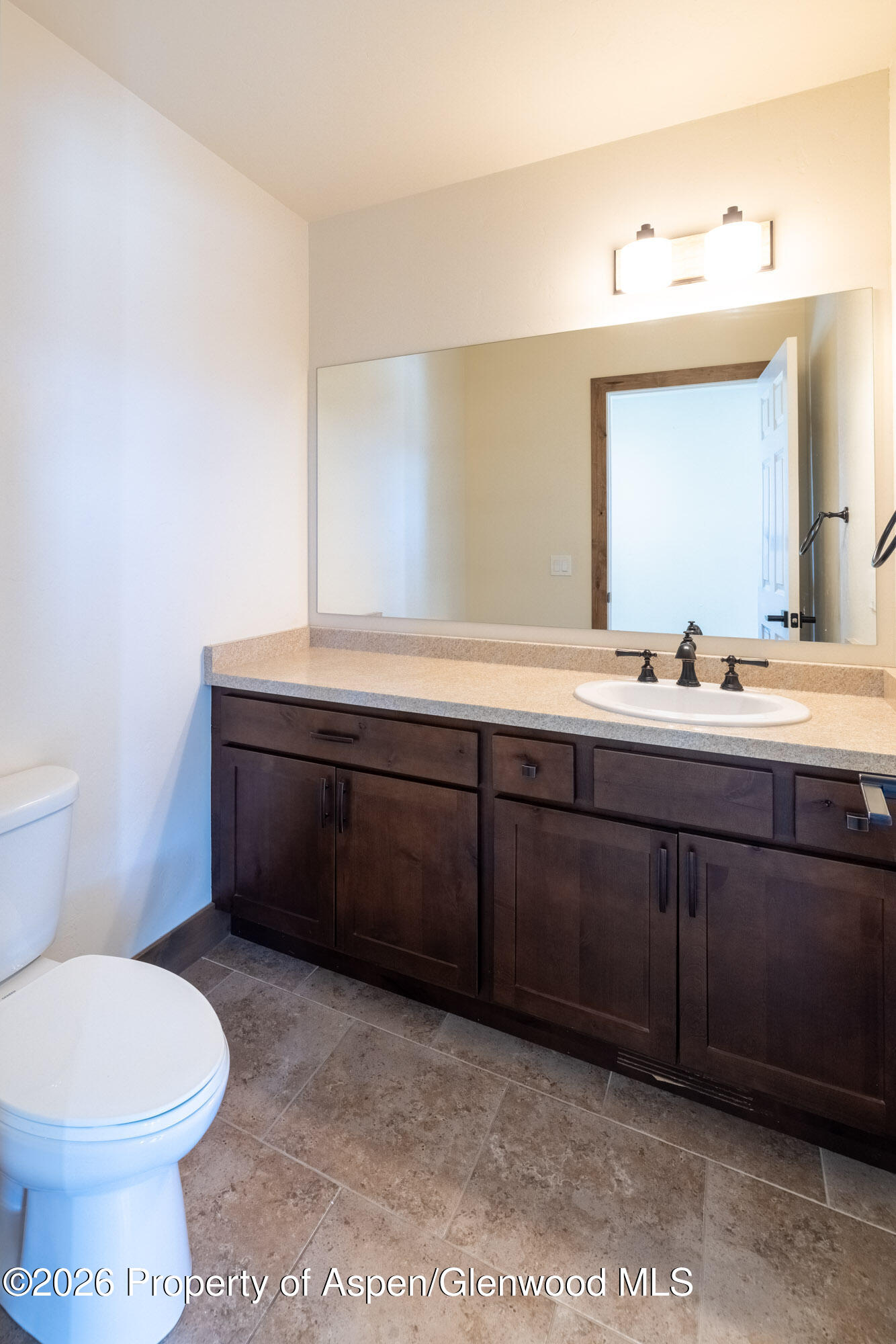 2016 Ballard Avenue Silt, CO 81652 - Photo 16 of 23 a bathroom with a sink a toilet and mirror