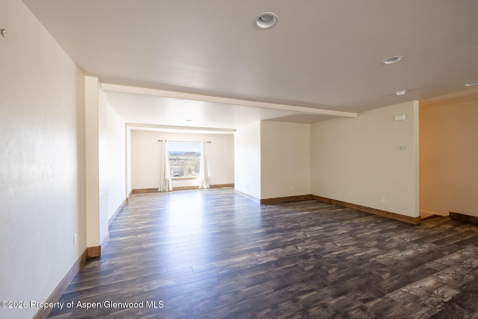2016 Ballard Avenue Silt, CO 81652 - Photo 6 of 23 a view of an empty room with wooden floor and closet