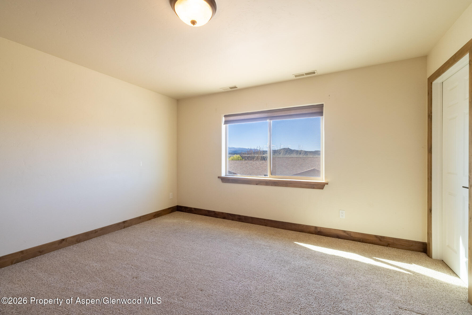 2016 Ballard Avenue Silt, CO 81652 - Photo 10 of 23 an empty room with windows