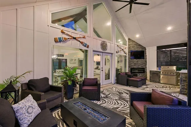 a living room with furniture fireplace and window