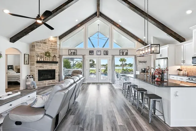 a view of a livingroom with furniture fireplace and window