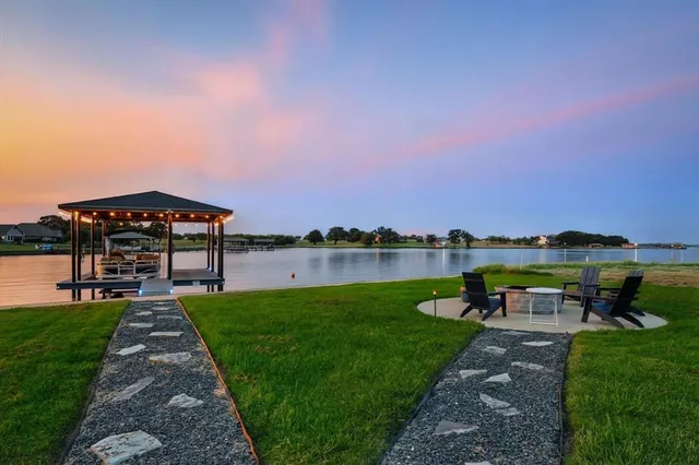 a view of a garden with a lake view