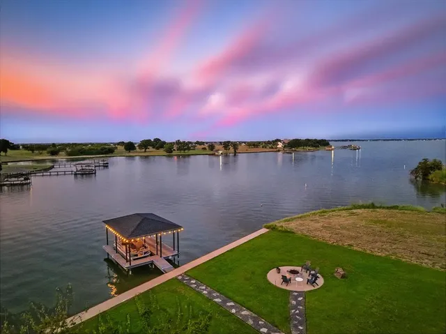 a view of a lake with a yard
