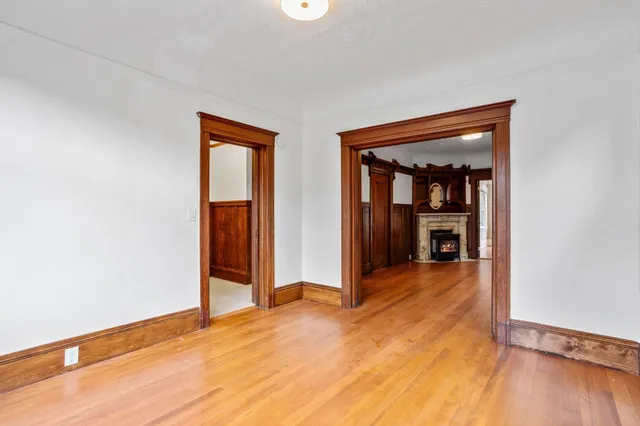 a bedroom with furniture and a large window