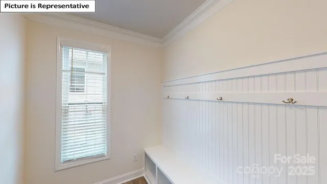 a view of room with window and hardwood floor