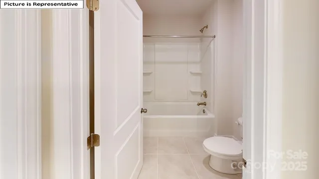 a bathroom with a toilet and a bathtub