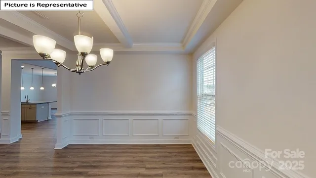 a view of a livingroom with wooden floor