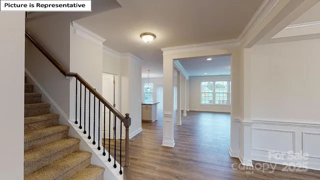 a view of an entryway with wooden floor