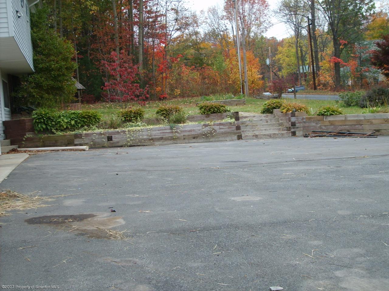 15 Pine Ridge Road Tunkhannock, PA 18657 - Photo 11 of 11 a backyard of a house with a yard and outdoor seating