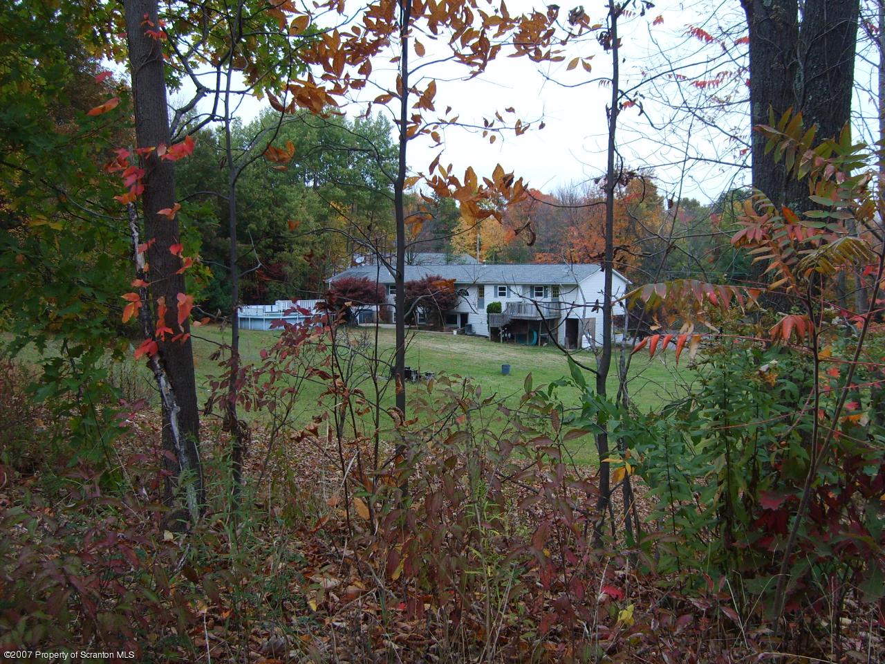 15 Pine Ridge Road Tunkhannock, PA 18657 - Photo 2 of 11 a view of a garden with a house in the background