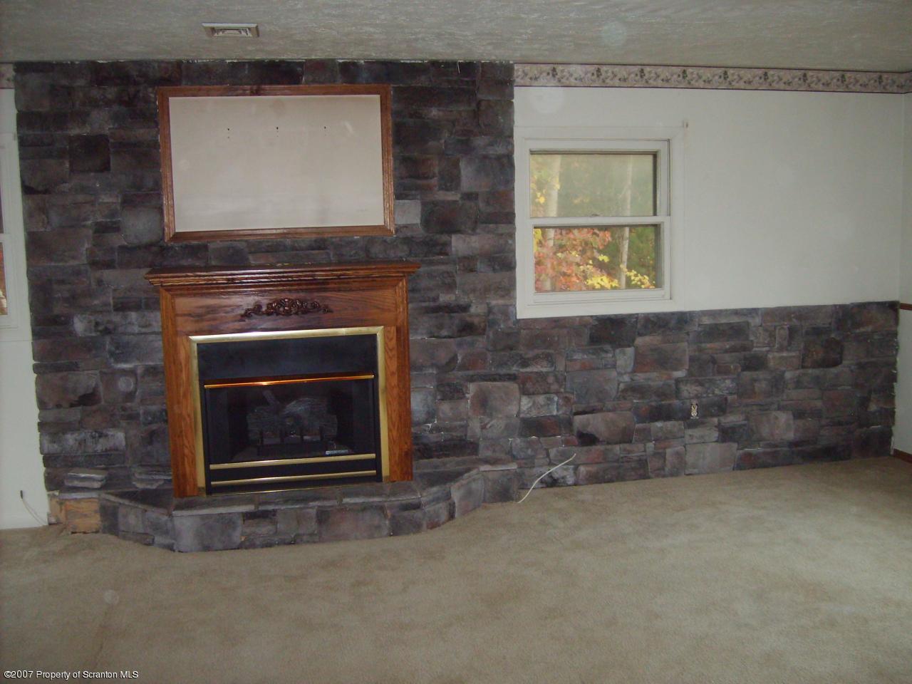 15 Pine Ridge Road Tunkhannock, PA 18657 - Photo 3 of 11 a living room with a fireplace