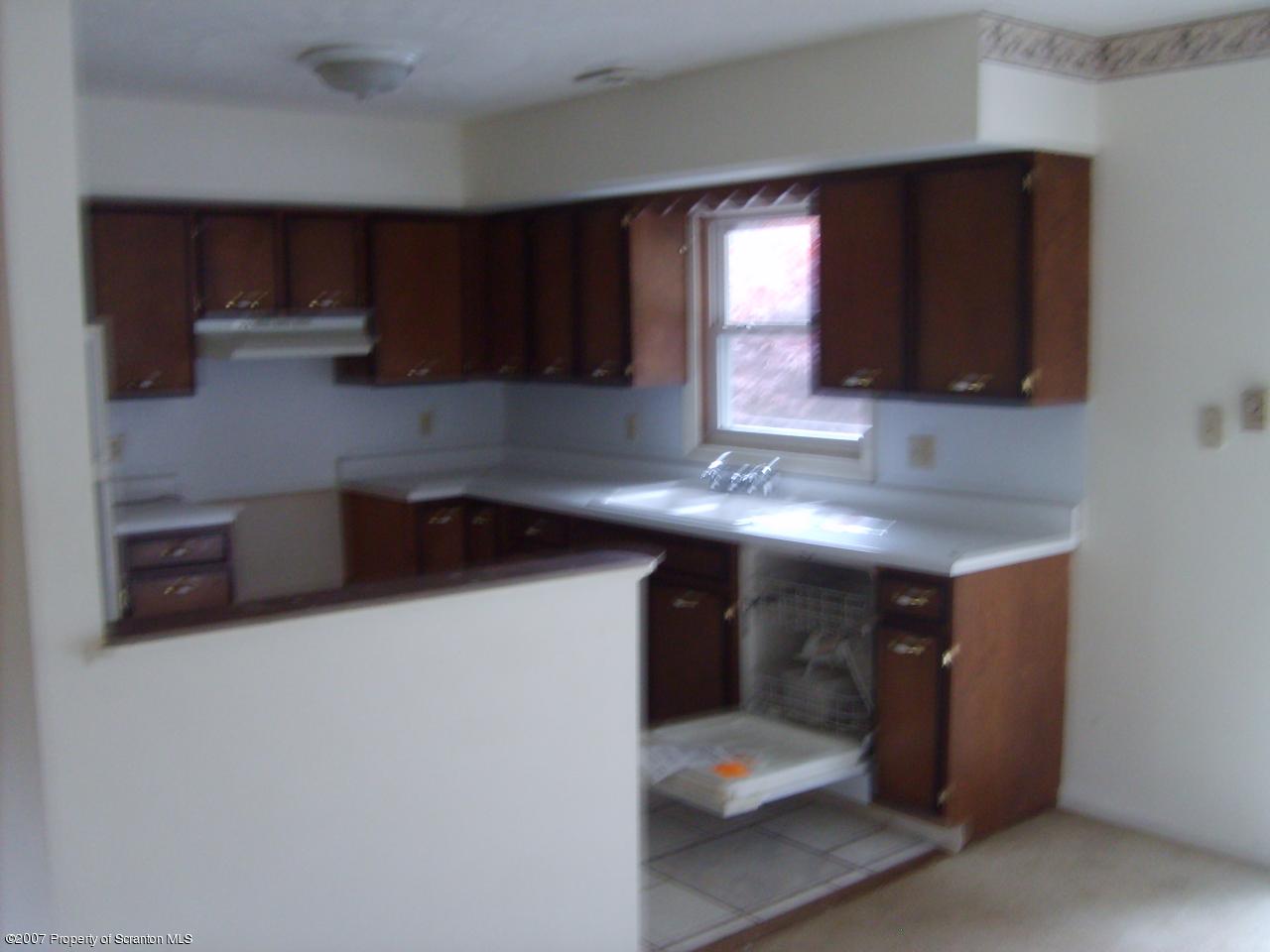 15 Pine Ridge Road Tunkhannock, PA 18657 - Photo 5 of 11 a kitchen with stainless steel appliances a microwave a sink and cabinets