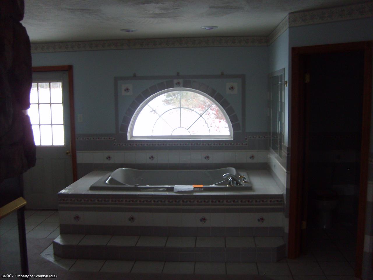 15 Pine Ridge Road Tunkhannock, PA 18657 - Photo 6 of 11 a bathroom with a sink and a window
