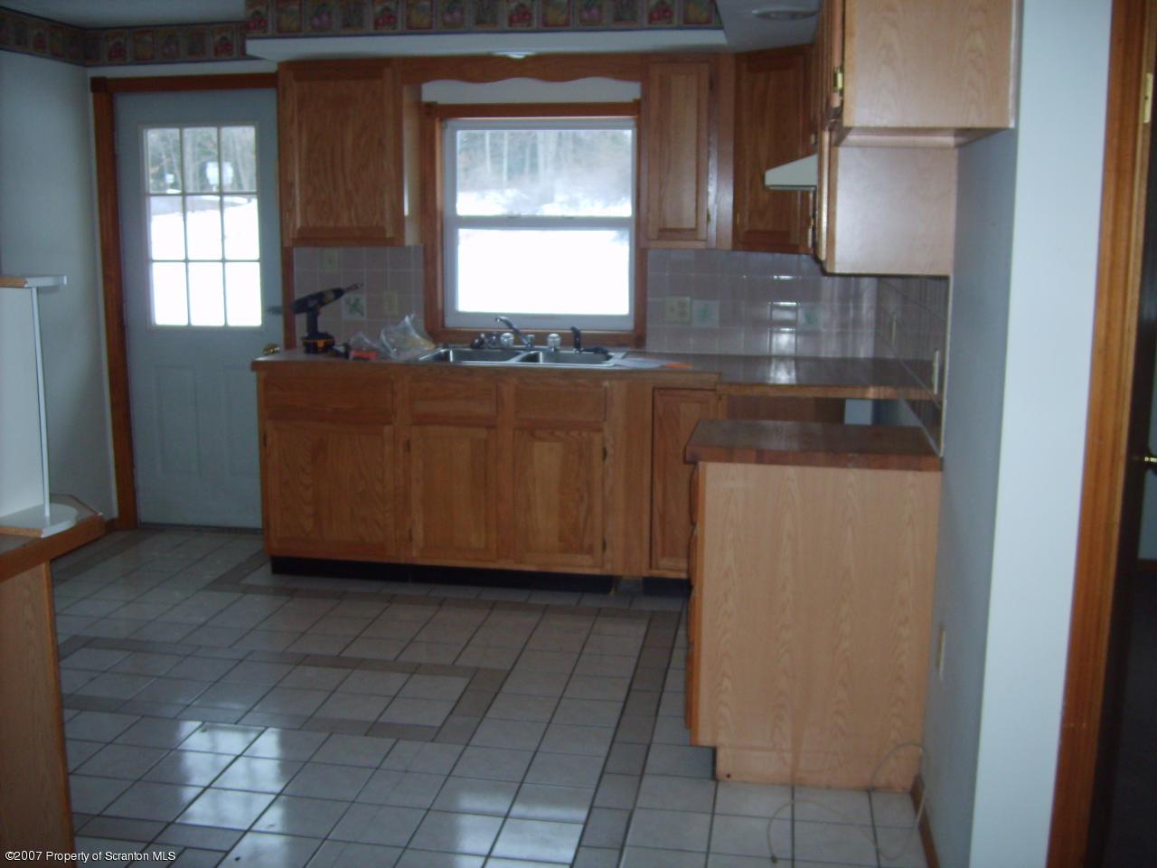 15 Pine Ridge Road Tunkhannock, PA 18657 - Photo 8 of 11 a room with granite countertop a sink and a vanity