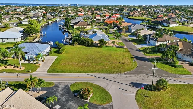 an aerial view of residential house with outdoor space and swimming pool