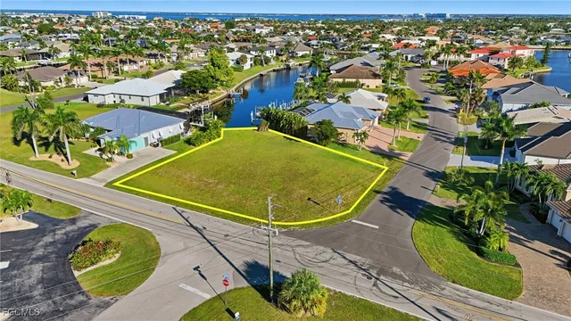 an aerial view of a house with a swimming pool yard and outdoor seating