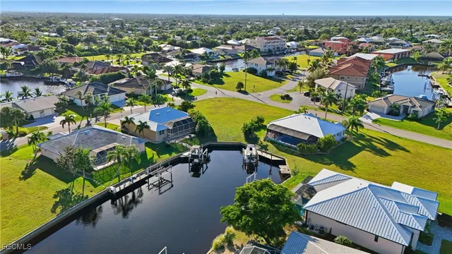 an aerial view of a residential houses with outdoor space