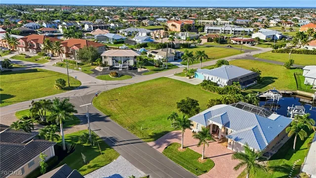 an aerial view of residential house with outdoor space and swimming pool