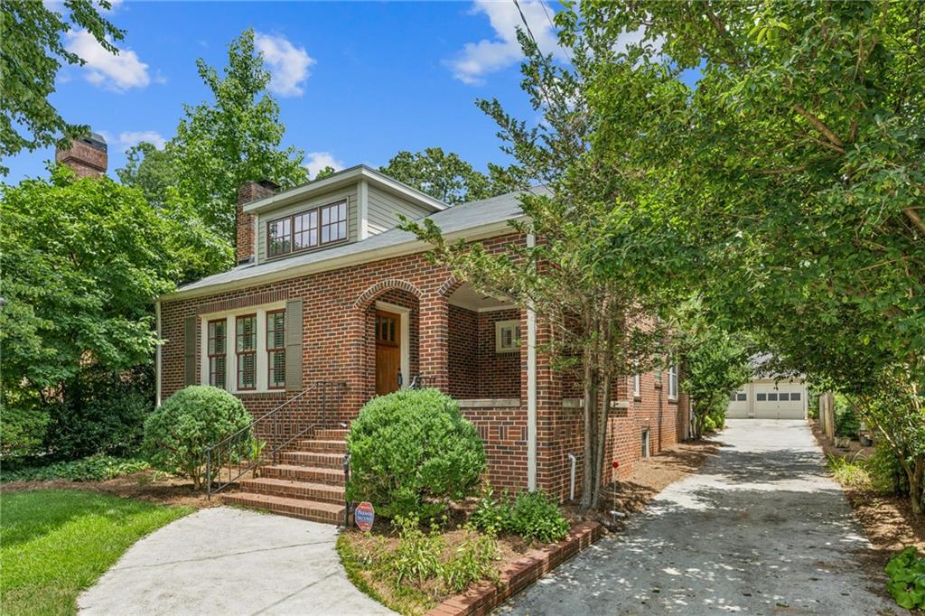 211 Superior Avenue Decatur, GA 30030 - Photo 1 of 1 a front view of a house with garden