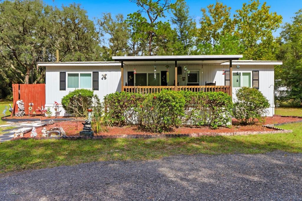 2911 East Raccoon Court Inverness, FL 34452 - Photo 1 of 1 front view of a house with a yard