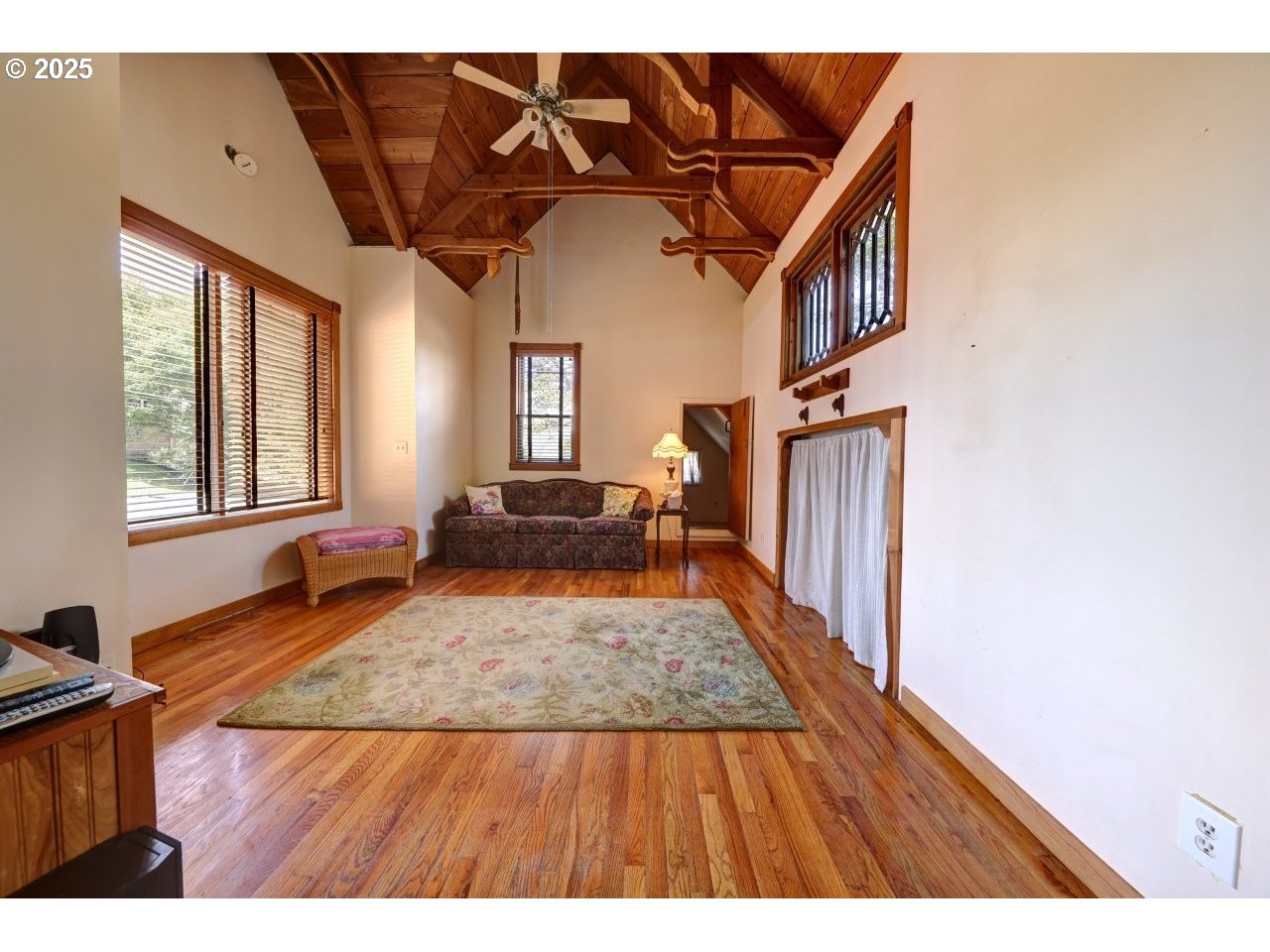 123 West 1st Street Cannon Beach, OR 97110 - Photo 5 of 35 a view of a livingroom with wooden floor and staircase