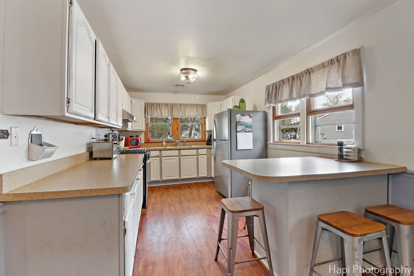 85 Bay Road Fox Lake, IL 60020 - Photo 8 of 22 a kitchen with kitchen island a sink table and chairs