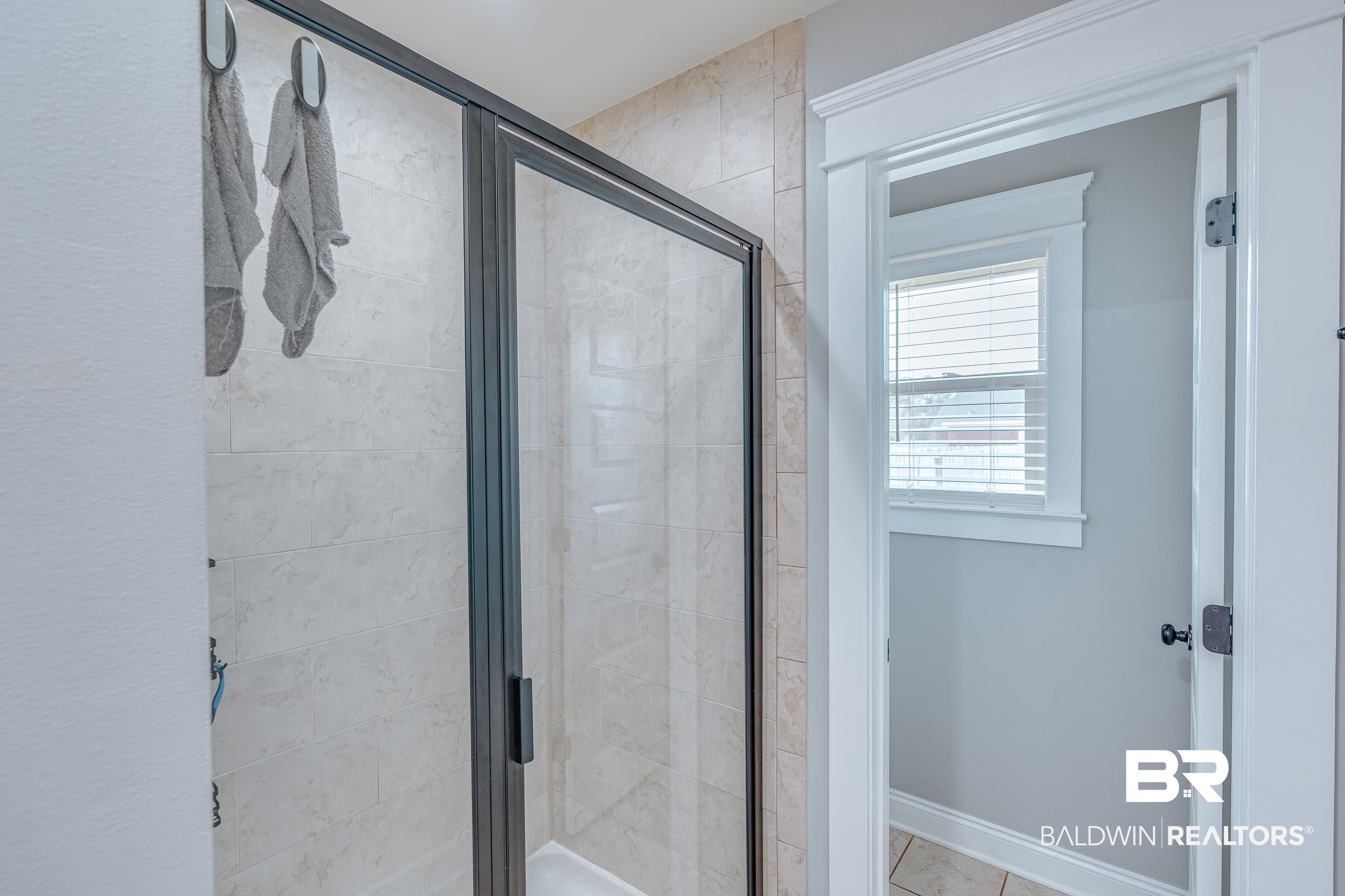 13235 Tom Gaston Road Mobile, AL 36695 - Photo 19 of 43 Bathroom featuring a shower with door