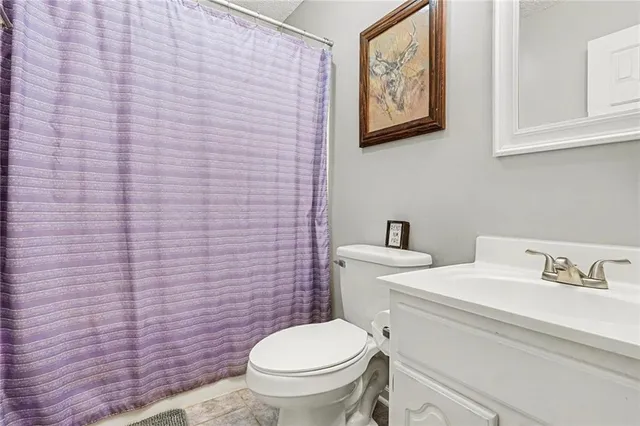 a bathroom with a toilet and a sink