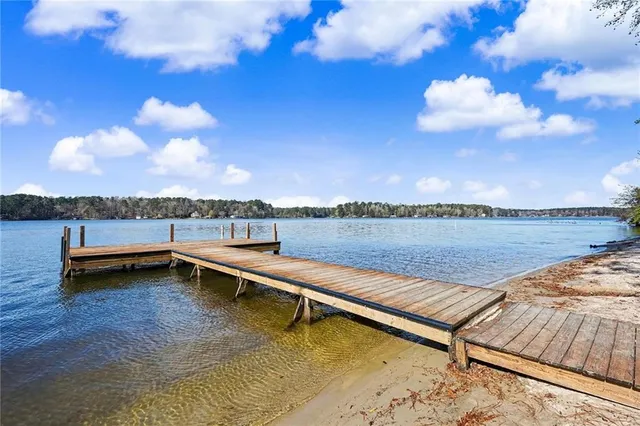 a view of a lake with sitting area