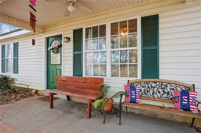 a backyard of a house with outdoor seating