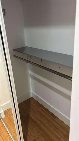 a view of a room with wooden floor and deck