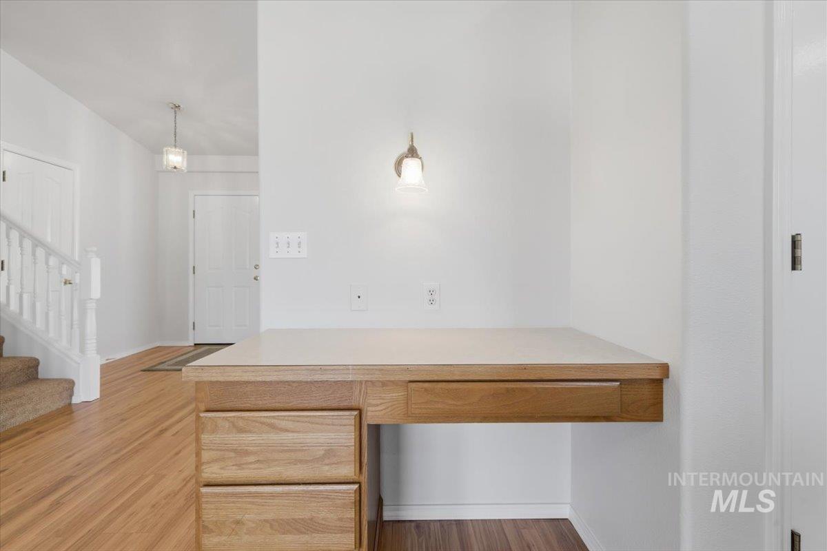 1128 West State Street Meridian, ID 83642 - Photo 16 of 50 Built-in desk featuring a light wood-finish countertop and cabinetry