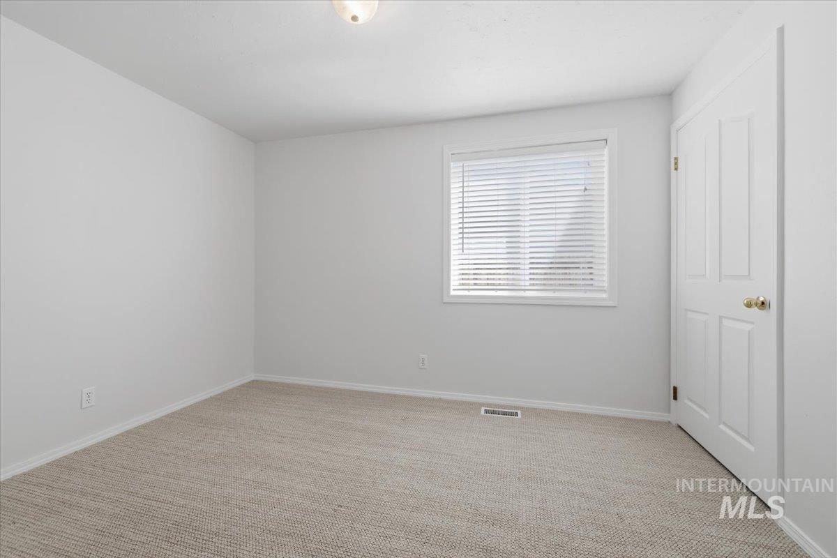 1128 West State Street Meridian, ID 83642 - Photo 28 of 50 Neutral tone walls and beige carpeting