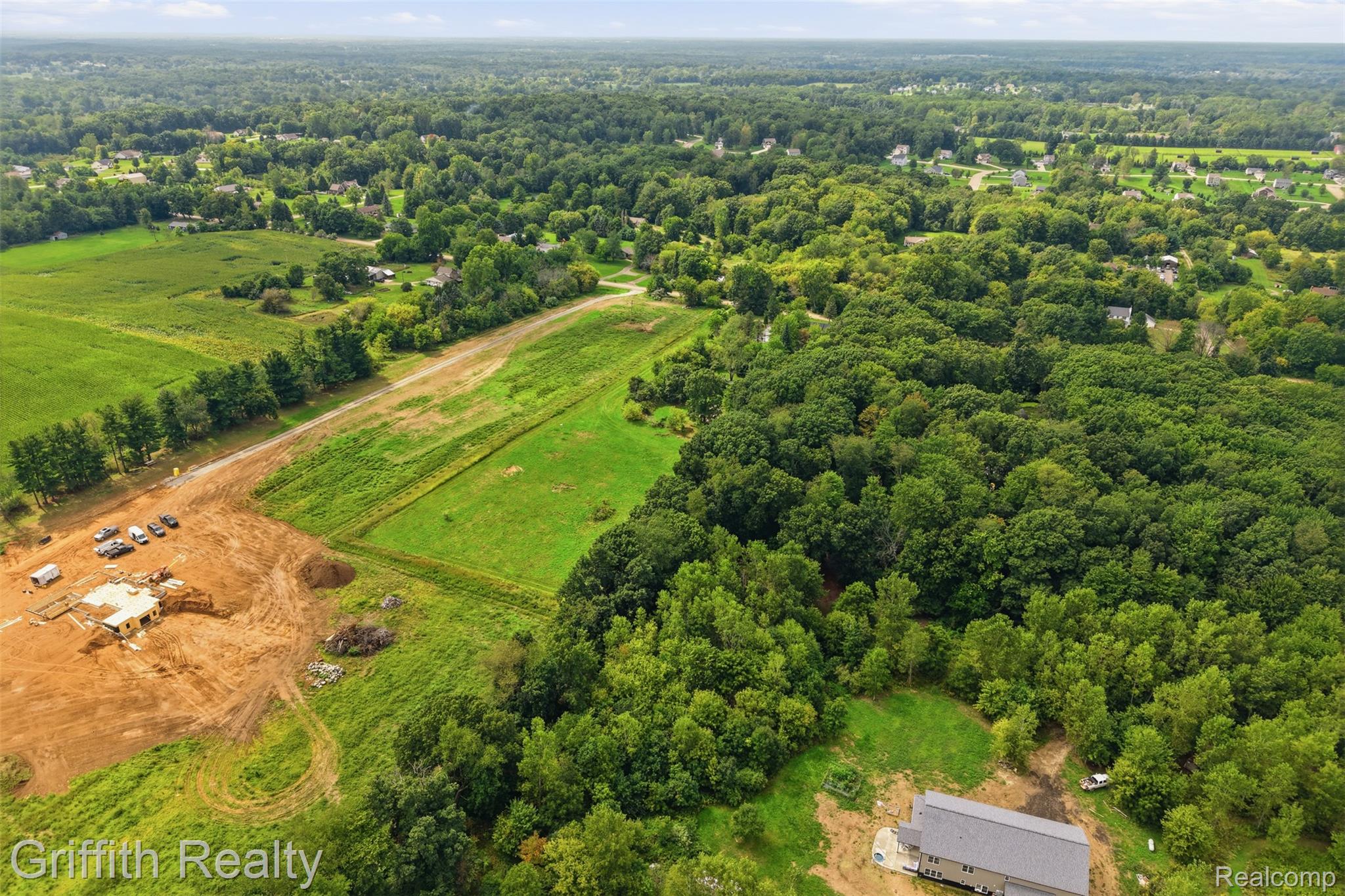 5820 Mack Road Howell, MI 48855 - Photo 58 of 60 Expansive lot with partial clearing, surrounded by mature trees and verdant fields
