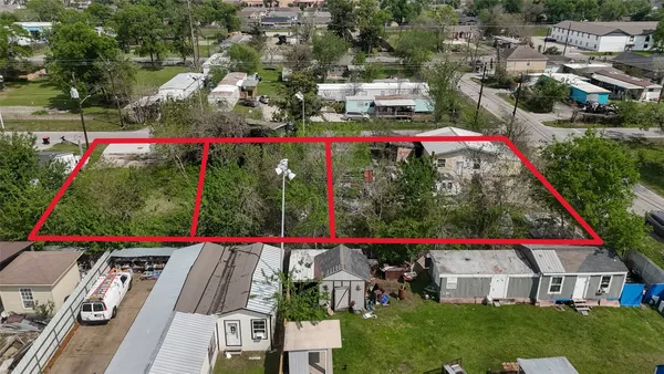 a view of swimming pool and red chairs under an umbrella