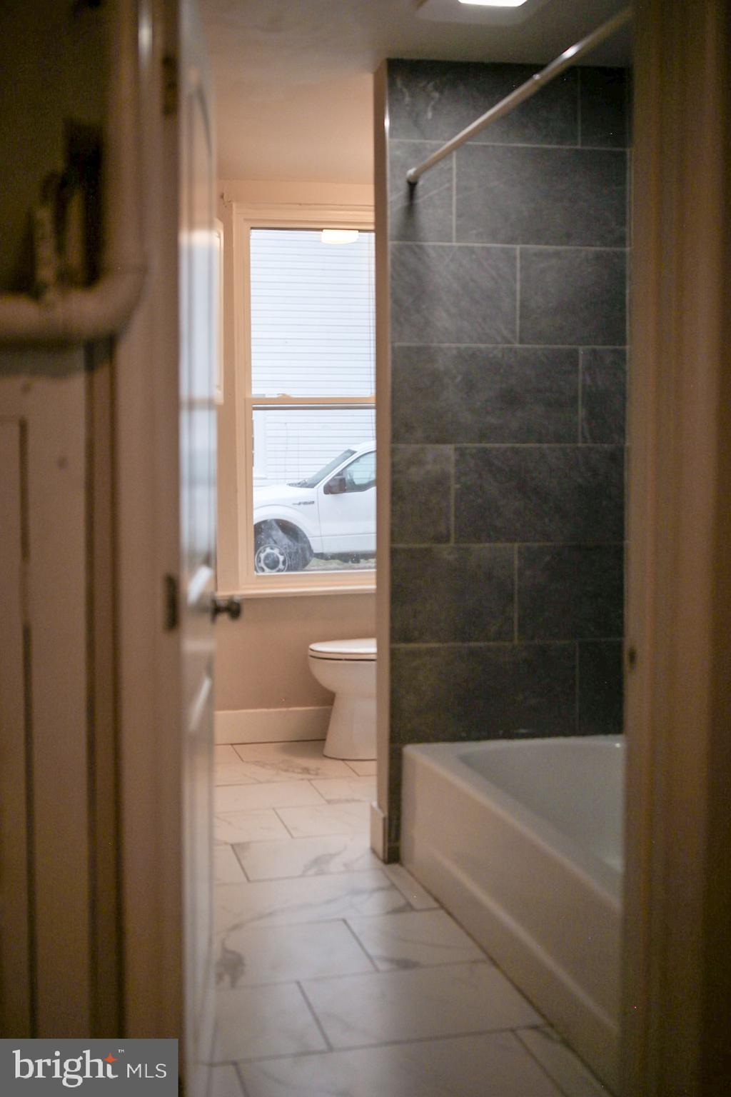 179 Main Street Hartly, DE 19953 - Photo 13 of 43 a bathroom with a bathtub and a shower