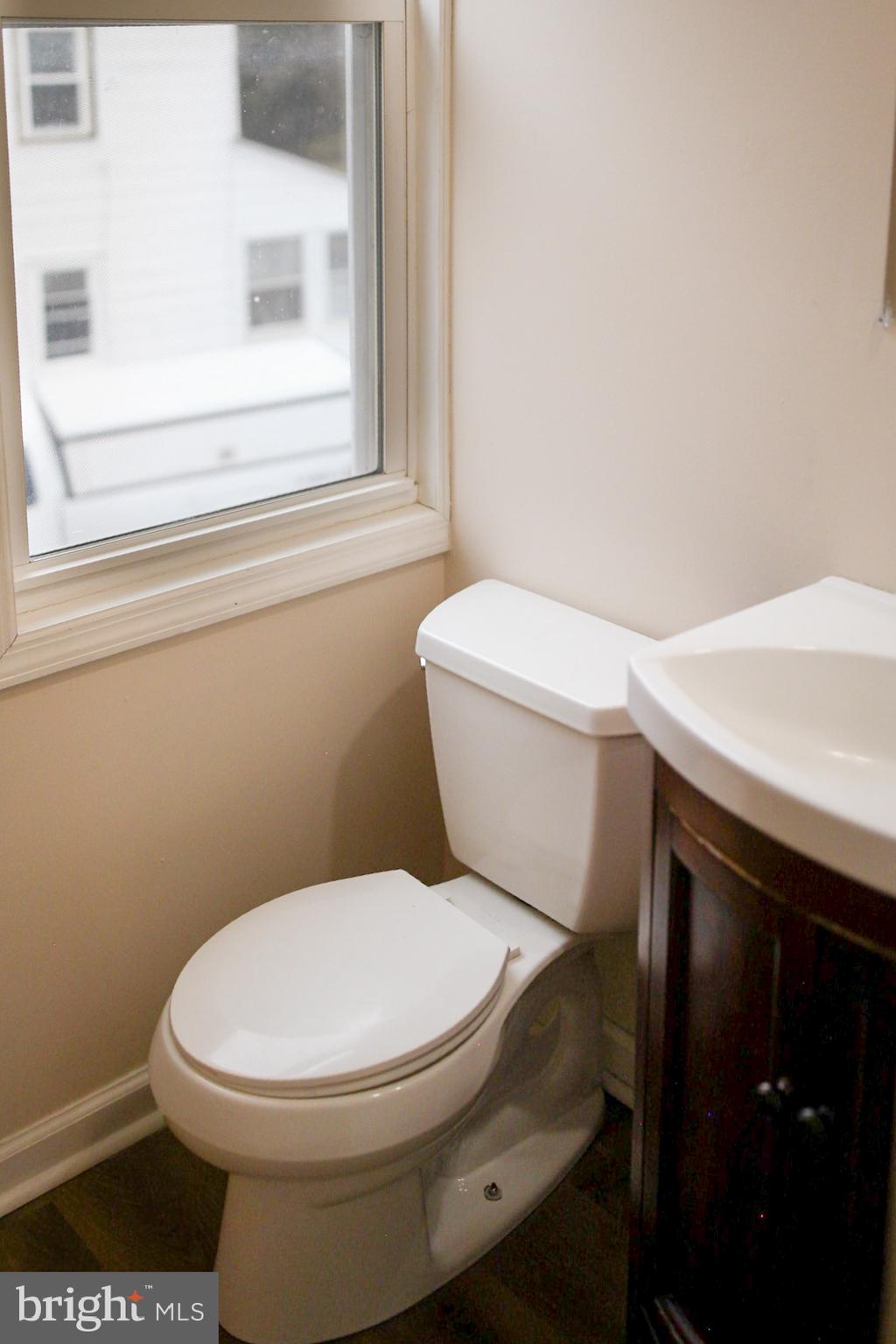 179 Main Street Hartly, DE 19953 - Photo 15 of 43 a white toilet sitting next to a bathroom sink