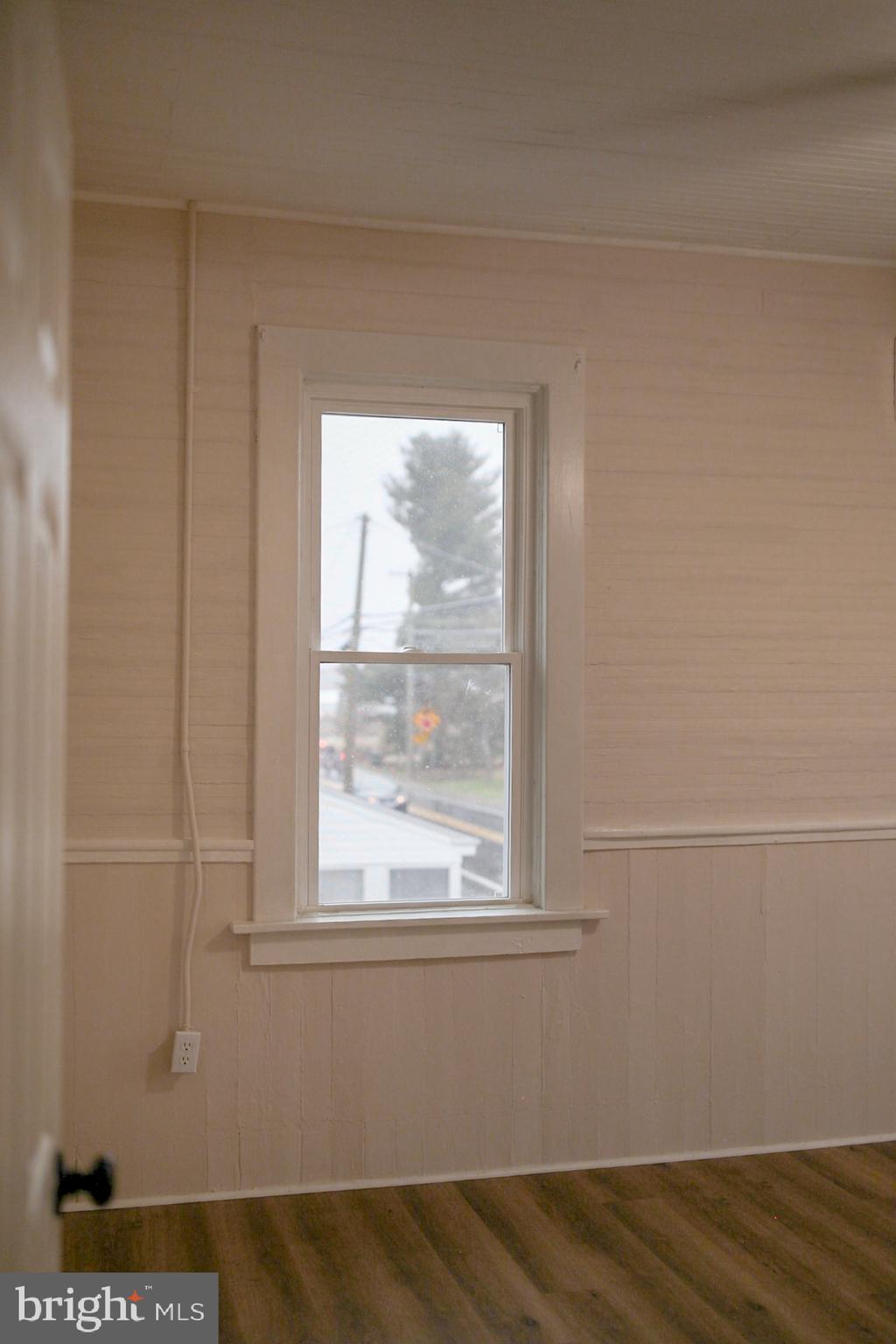 179 Main Street Hartly, DE 19953 - Photo 18 of 43 a view of a small space with wooden floor and a window
